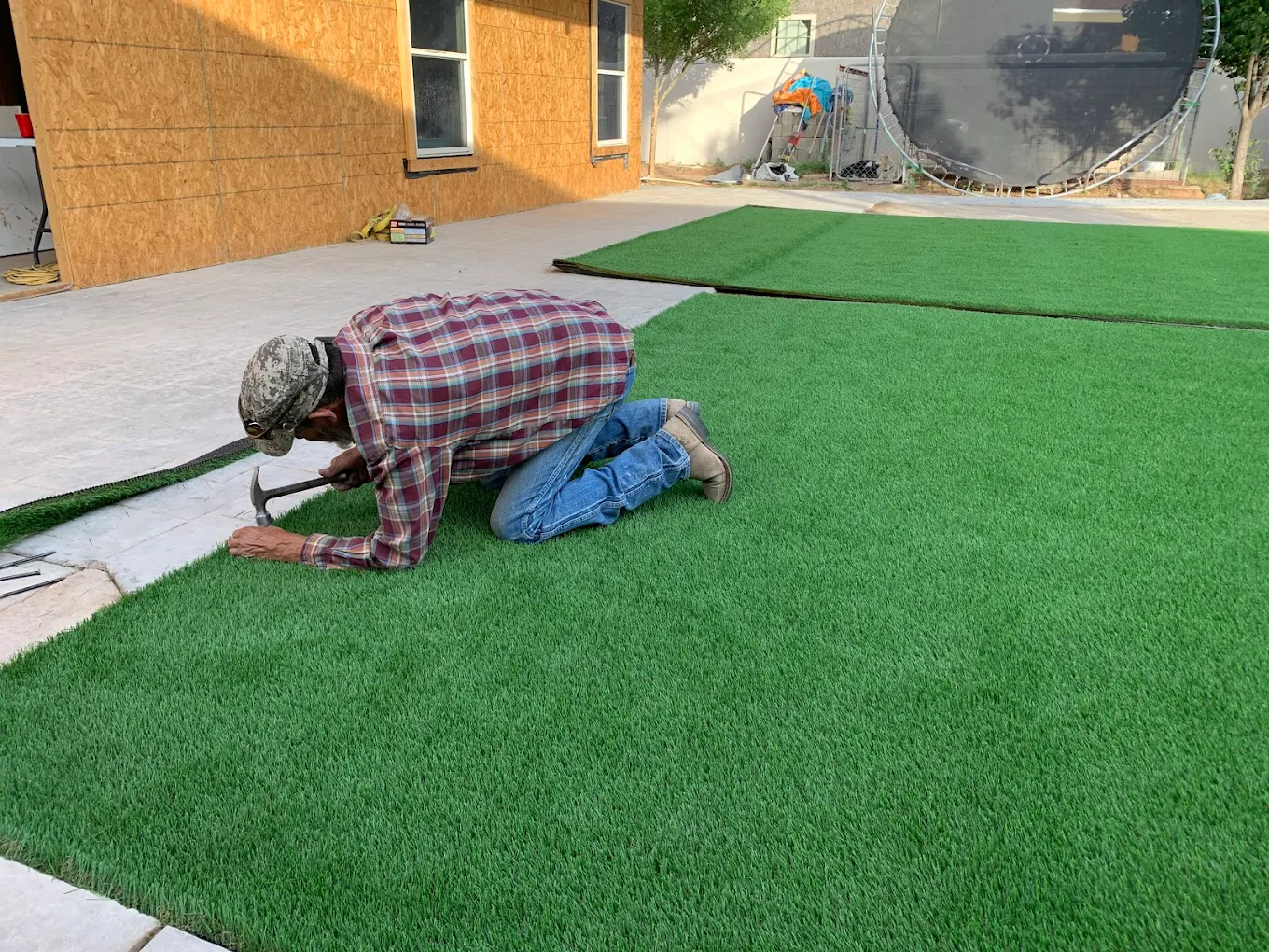 Synthetic grass installation in progress
